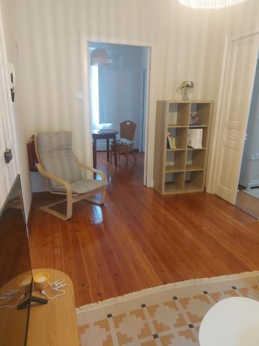 a living room with a chair and a table at El Café I in Nava