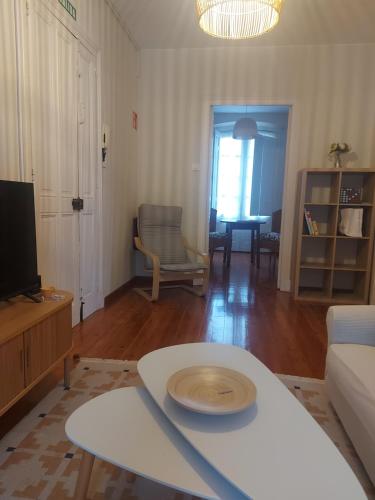 a living room with a couch and a table at El Café I in Nava