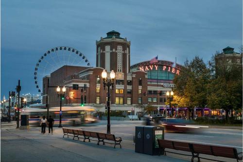 a city street with a ferris wheel in the background at Kasa Lake Shore Chicago in Chicago