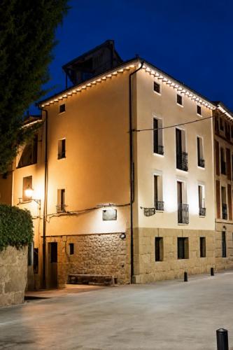 a building with lights on the side of it at Casa Ilera II, en el corazon de Rioja Alta 8 PAX in Casalarreina