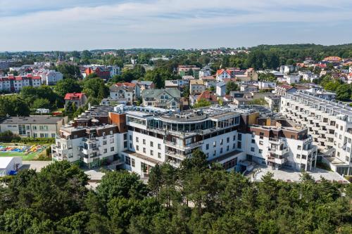 an aerial view of a city with buildings at Maloves Resort & Spa in Władysławowo