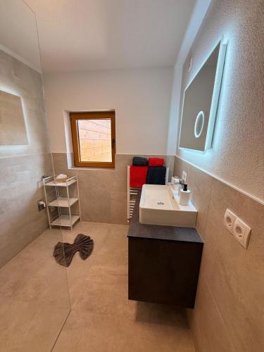 a bathroom with a sink and a mirror at Alpenecho in Neustift im Stubaital