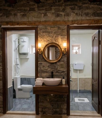 a bathroom with a sink and a mirror at Ecomama in Xınalıq Khinalig guest house in Xınalıq