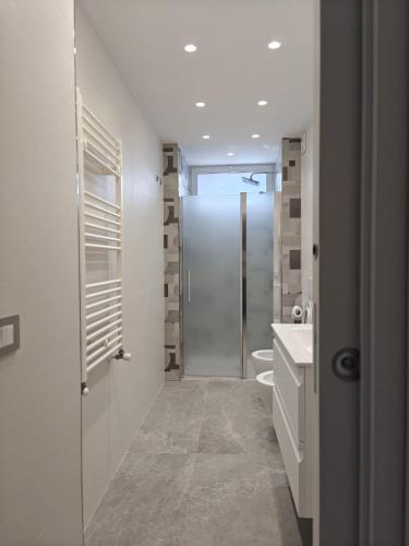 a bathroom with a shower and a toilet and a sink at My Sicily apartments in Taormina