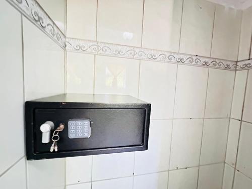 a safe on the wall of a bathroom at HappiCasaRD & Holistic House in Sosúa