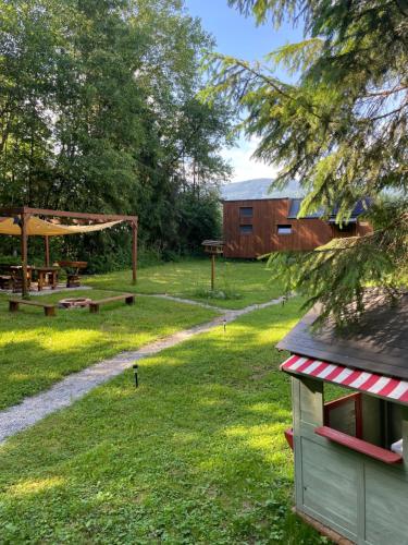 a yard with a picnic table and a shed at koliBka - tiny house in Michalová