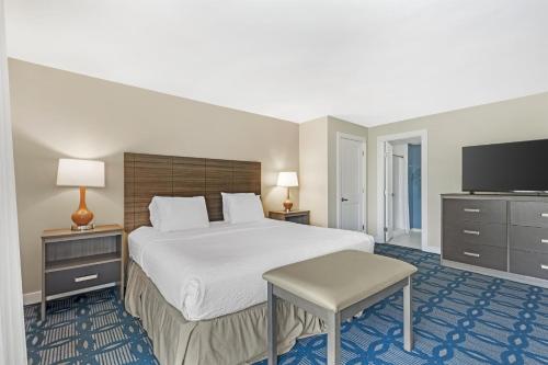 a hotel room with a bed and a television at Best Western Plus Ocean City in Ocean City