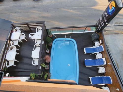 a group of chairs on the roof of a boat at Hotel Vila Mar in Florianópolis