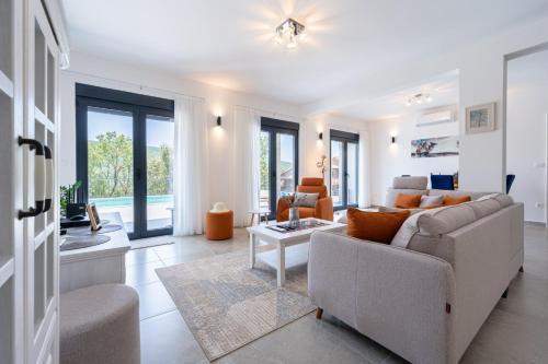 a living room with a couch and a table at Villa Montenegrina in Krapina