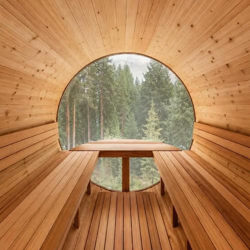 a wooden sauna with a round window in a forest at Blue Moose Private pool spa sauna lake access in Wentworth