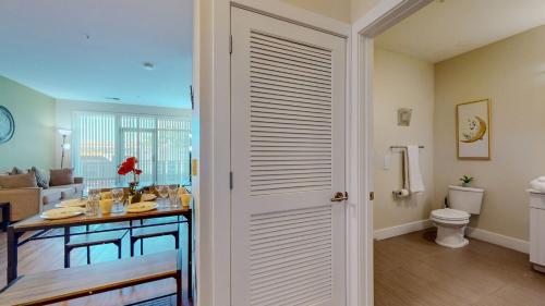 a bathroom with a table and a toilet in a room at Elegant Home in Stamford
