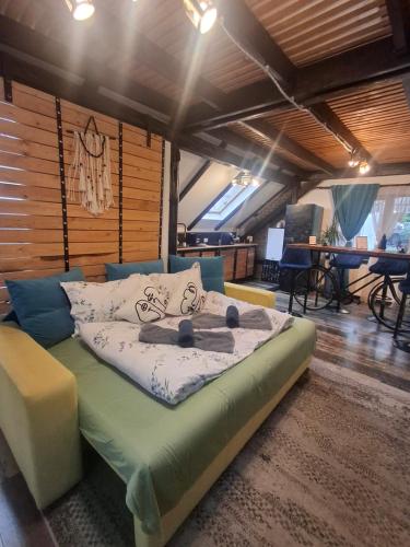 a room with a bed in a room with tables at Casa Anne Boutique in Braşov