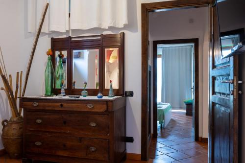 a bathroom with a dresser with a mirror on it at Casa La Terrazza in Vietri sul Mare