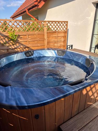 a jacuzzi tub sitting on a deck at Lisie Sprawki in Bebło