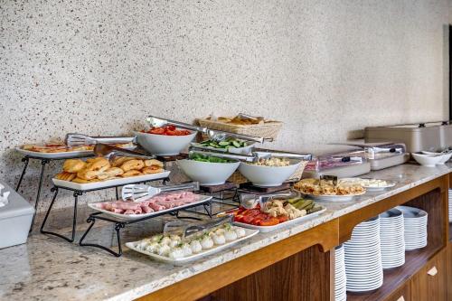 a buffet with many different types of food on a counter at Continental SPA Resort in Bukovel