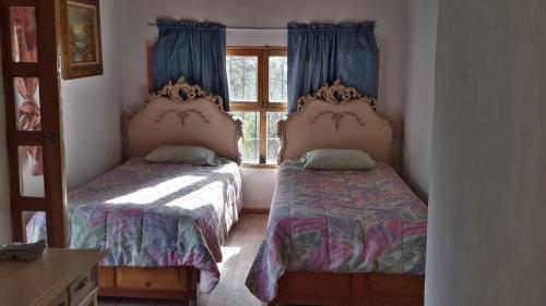 Postel nebo postele na pokoji v ubytování Ventana Al Desierto