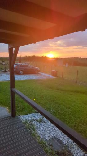 a car parked in a parking lot with the sunset at Dom nad wąwozem in Sandomierz