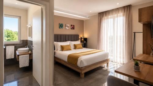 a hotel room with a bed and a bathroom at Brahma luxury B&B in Marigliano