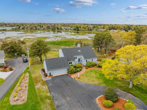 an aerial view of a house with a driveway at Waterfront Escape with Stunning Views on Bass River in West Dennis