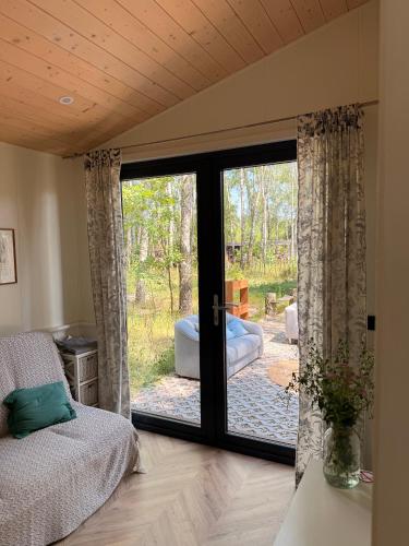 a bedroom with a sliding glass door to a patio at WieloHome in Wielogóra