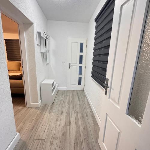 an empty hallway with a door and a room at Villa RELAX Miševići in Sarajevo