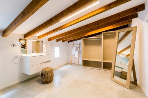 a large room with white cabinets and a mirror at Villa Ca na Marrona - Sunset Villa Campanile in Sa Pobla