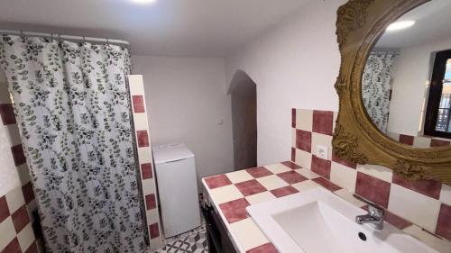 a bathroom with a sink and a mirror at Cuevas Padre Poveda in Guadix