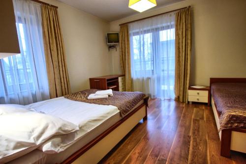 Tempat tidur dalam kamar di ZAKOcentrum