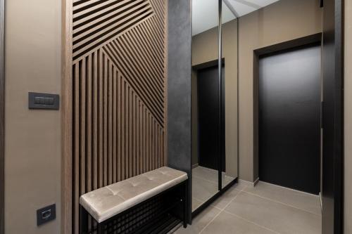 a walk in shower with a bench and a mirror at Rooms with a parking space Mali Losinj (Losinj) - 9681 in Mali Lošinj