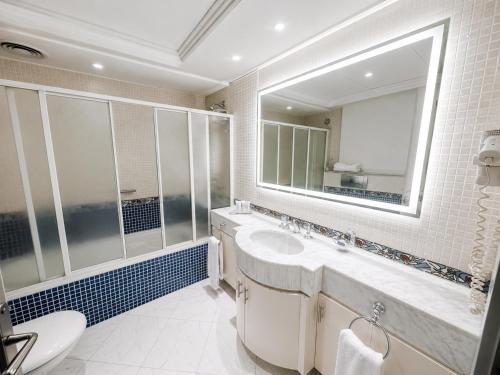 a bathroom with a sink and a mirror at Private Luxury Villas at Sharm Dreams Vacation Club in Sharm El Sheikh