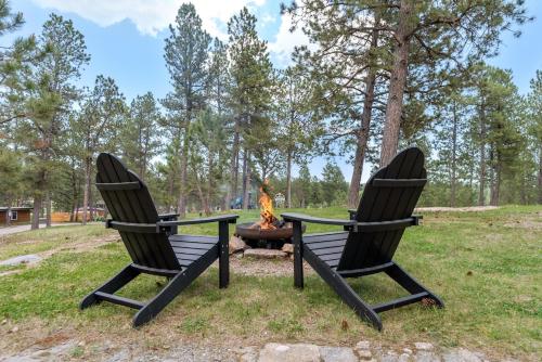 two chairs with a fire pit in a park at Rustic Sanctuary BHBungalows #7 in Custer