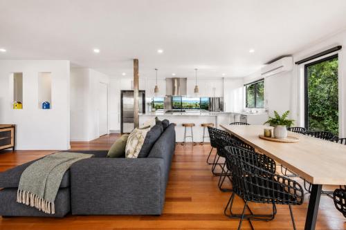 a living room with a couch and a table at Nautilus by Ready Set Stay in Rye