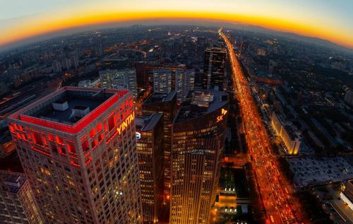 an aerial view of a city at night at Park Hyatt Beijing in Beijing