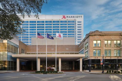 a marriott building with flags in front of it at Louisville Marriott Downtown in Louisville