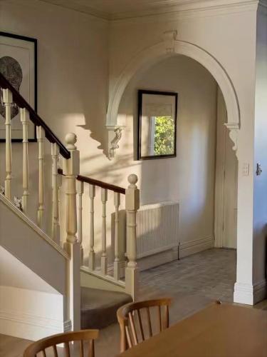 a staircase in a house with a stair case at Sublime Luxury - Battery Point in Hobart