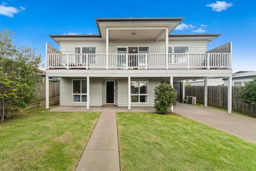 a large white house with a large yard at San Remo Bay Views Phillip Island Gateway in San Remo