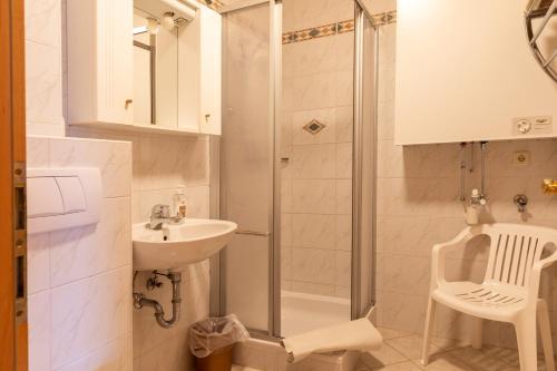 a bathroom with a shower and a sink at Haus Obweg - Postalm in Abtenau
