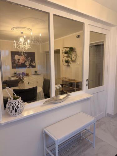 a reflection of a living room in a mirror at Haus EL MILO in Jadranovo
