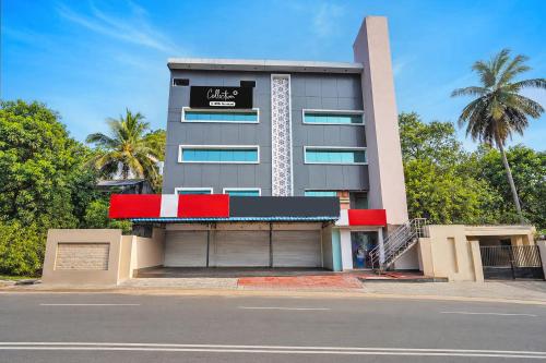 a building with a sign on the front of it at Collection O Tennati Park Vizag Beach Formerly B Square Villa in Visakhapatnam