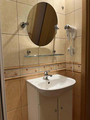 a bathroom with a sink and a mirror at Rafa in Rowy