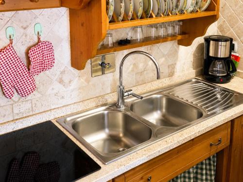 a stainless steel sink in a kitchen at Agriturismo Signorini in Orciatico