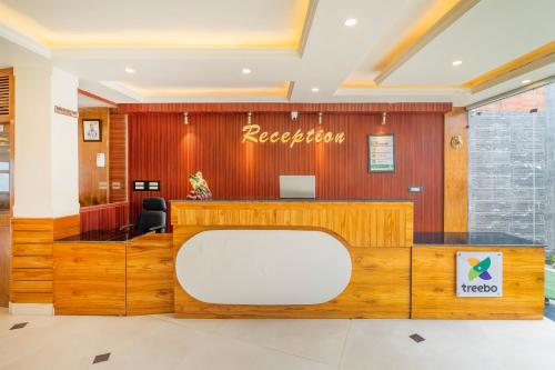 a lobby with a reception desk in a building at Treebo Fagu Peaks in Shimla