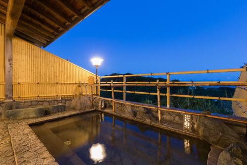 a pool of water with a street light on a building at Ashizuri Kokusai Hotel in Tosashimizu