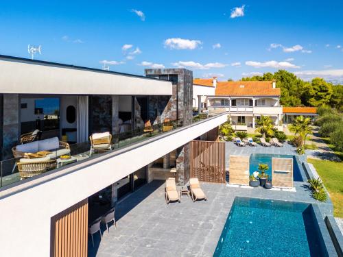 an aerial view of a house with a swimming pool at Villa Sika in Vir
