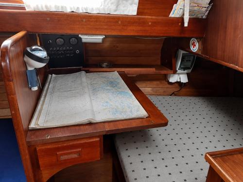a small room with a table with a map on it at Varuna jachta in Nida