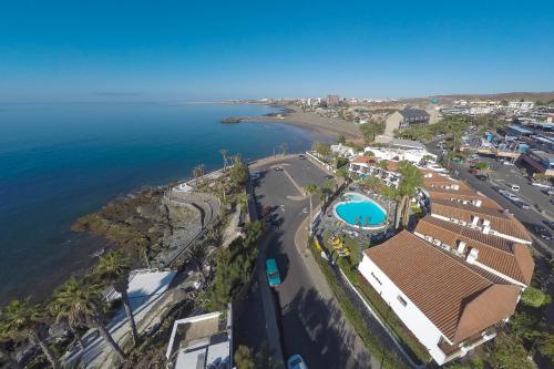 an aerial view of a beach and the ocean at Sunsuites Carolina in San Agustin