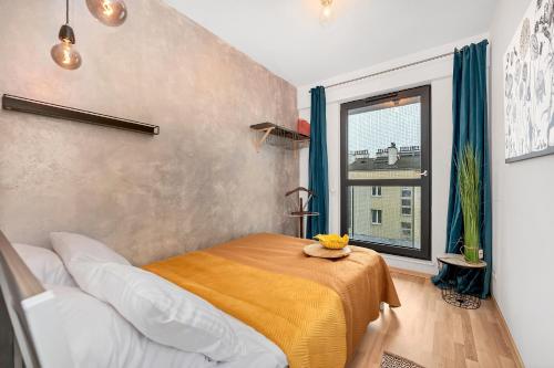 a bedroom with a bed and a window at Lumina I 3BR Apartment with Balcony I Parking I 2 Bathrooms I near Center in Warsaw
