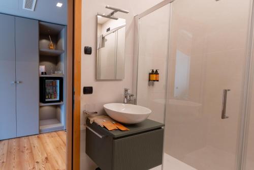 a bathroom with a sink and a shower at Agriturismo Camerin - CL Agri Lounge in Conegliano