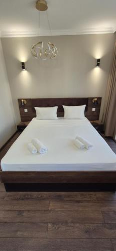a bedroom with a large white bed with two pillows at MitProt Panorama Bay 2 Luks Studio 170 in Sveti Vlas