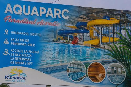 a large swimming pool with a water slide at Pensiunea ober in Braşov